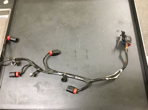 To wire a 12-volt starter solenoid, first disconnect the black negative cable from the vehicles battery, and then connect the red battery cable to the large bolt on the solenoid. . Mds solenoid wiring harness